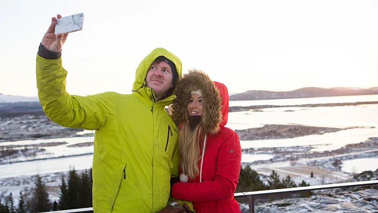 Tourists Enjoy The Golden Circle Tour In Iceland