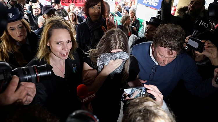 A British Woman, Accused Of Lying About Being Gang Raped, Covers Her Face As She Arrives At The Famagusta Courthouse In Paralimni