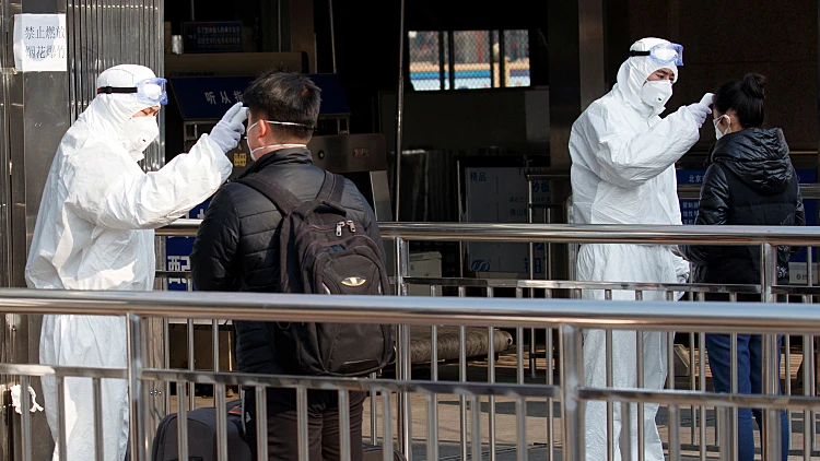 Workers Take The Body Temperature Of Passengers Before They Enter The Subway Station Outside The Beijing Railway Station In Beijing