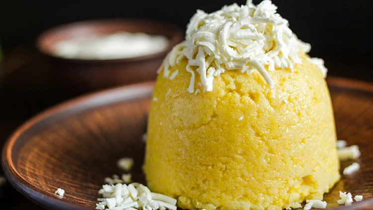 A,corn,porridge,(mamaliga),or,polenta,with,cheese,on,a