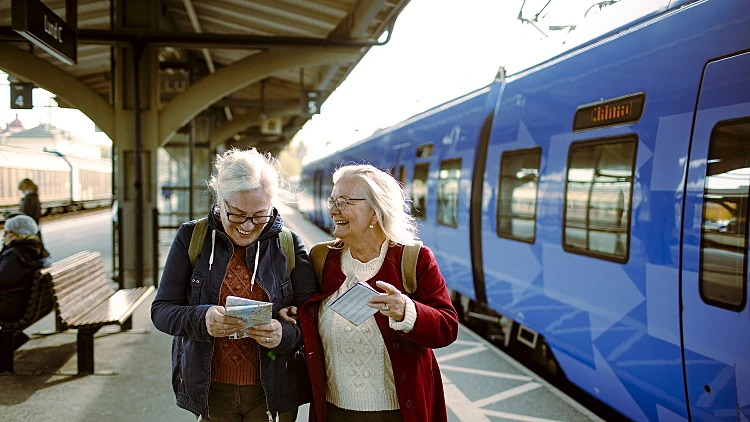 Seniors At A Train Station