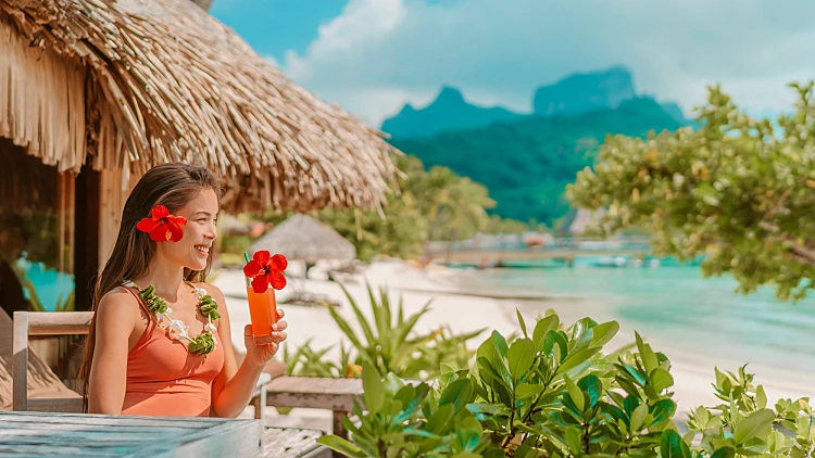 Breakfast,at,luxury,hotel,room,on,beach.,asian,woman,drinking