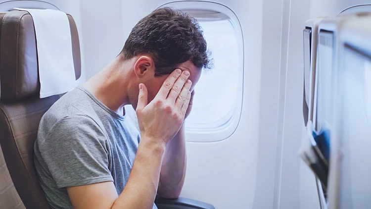 Headache,in,the,airplane,,man,passenger,afraid,and,feeling,bad