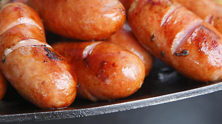 Hot,grilled,frankfurter,sausages,on,grill,pan.