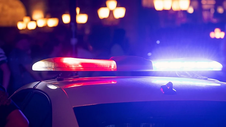 Police,car,in,the,city,at,night.