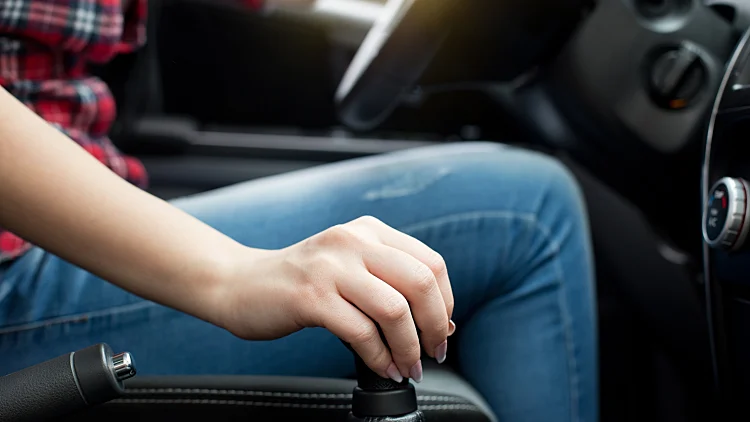 Young,woman,in,jeans,and,plaid,shirt,holding,hand,on