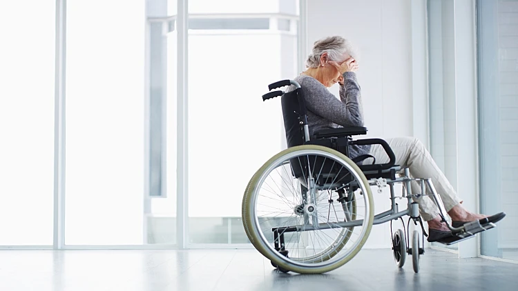Elderly,woman,,crying,and,wheelchair,at,window,with,space,,depression