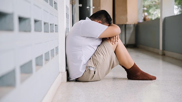 Thai,student,bullying,victim,by,classmates,crying,sadly,being,bullied,