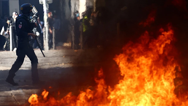 צרפת בוערת: עימותים אלימים ומאות עצורים במחאות ענק