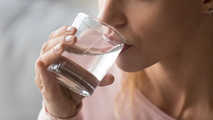 Close,up,cropped,image,thirsty,woman,holding,glass,drinks,still