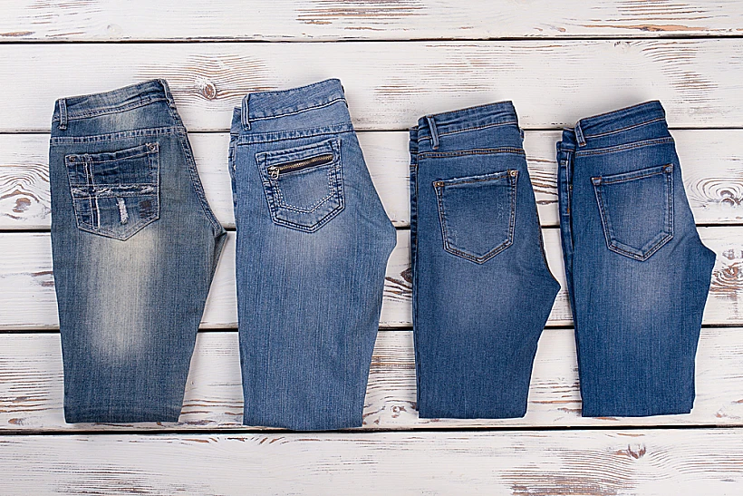 New,denim,collection,on,wooden,background.,refresh,your,wardrobe,with