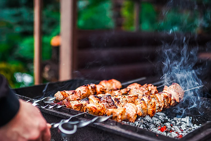 Grilled,kebab,cooking,on,metal,skewer.,roasted,meat,cooked,at