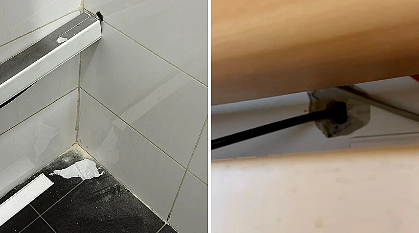 החור בקיר השירותים והחור בקיר המשרד של העובד שנעצר