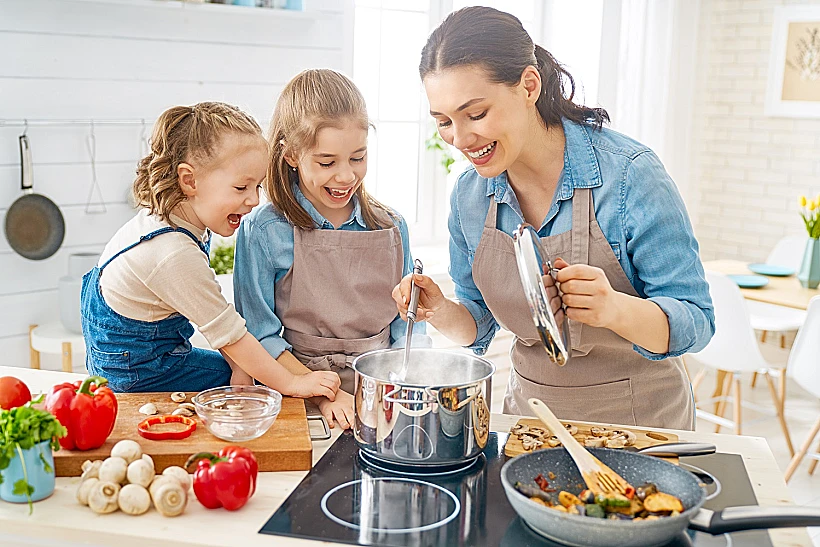 Happy Family In The Kitchen.
