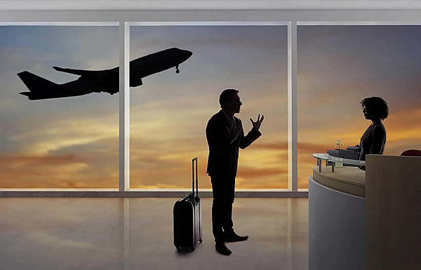 Stressed,out,businessman,passenger,arguing,with,a,flight,attendant,or