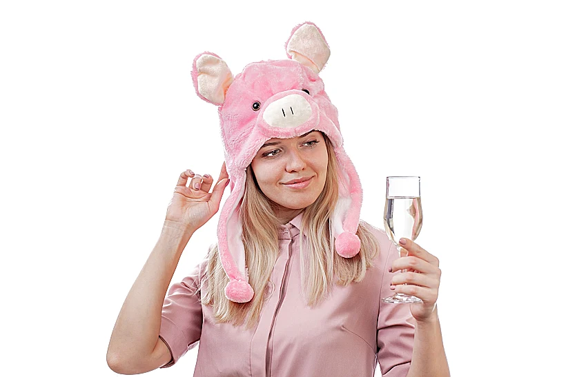 Girl,in,a,pig,hat,,holds,in,her,hand,a