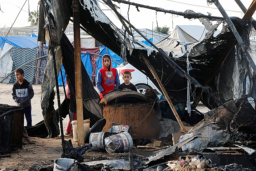 Palestinian Children Inspect The Site Of An Israeli Strike On A Tent Camp Housing Displaced People, In Al Mawasi Area, In Khan Younis In The Southern Gaza Strip