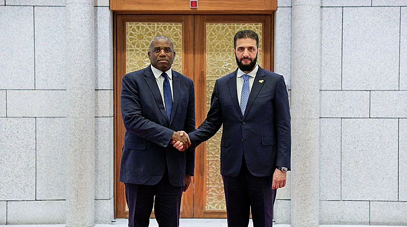 שר החוץ הבריטי דיוויד לאמי עם נשיא סוריה אחמד א-שרע