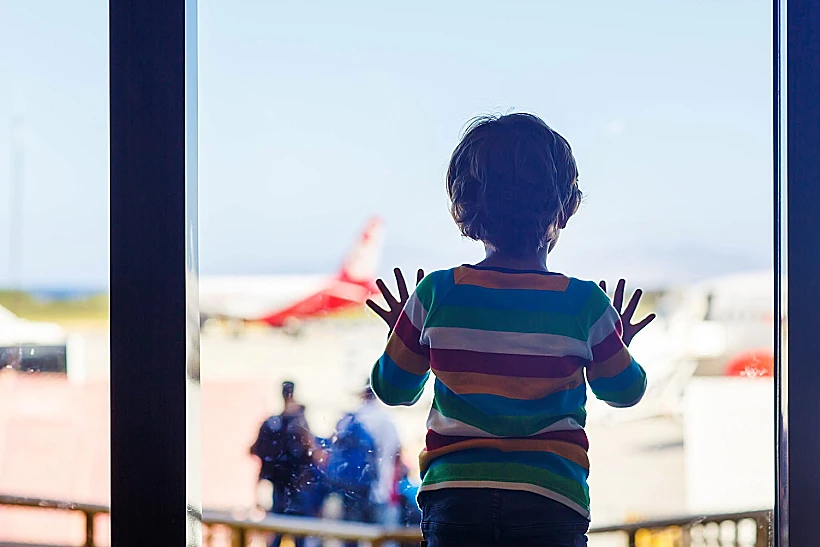 Cute,little,tired,kid,boy,at,the,airport,,traveling.,upset