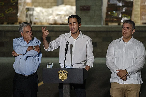 נשיא קולומביה ונשיא צ'ילה עם יו''ר האופוזיציה בוונצואלה חואן גויאדו