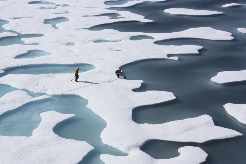 The Crew Of The U.s. Coast Guard Cutter Healy Retrieves Supplies Dropped By Parachute In The Arctic Ocean