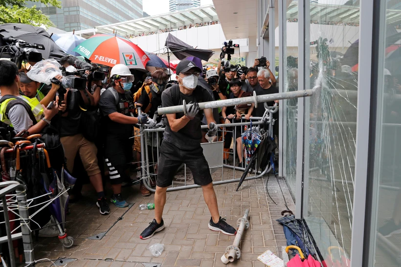 Protesters Try To Break Into The Legislative Council Building Where Riot Police Are Seen, During The Anniversary Of Hong Kong's Handover To China In Hong Kong