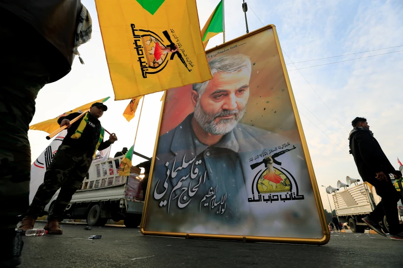 Kataib Hezbollah Iraqi Militia Hold The Picture Of The Iranian Major General Qassem Soleimani, As They Gather Ahead Of The Funeral Of The Iraqi Militia Commander Abu Mahdi Al Muhandis, In Baghdad
