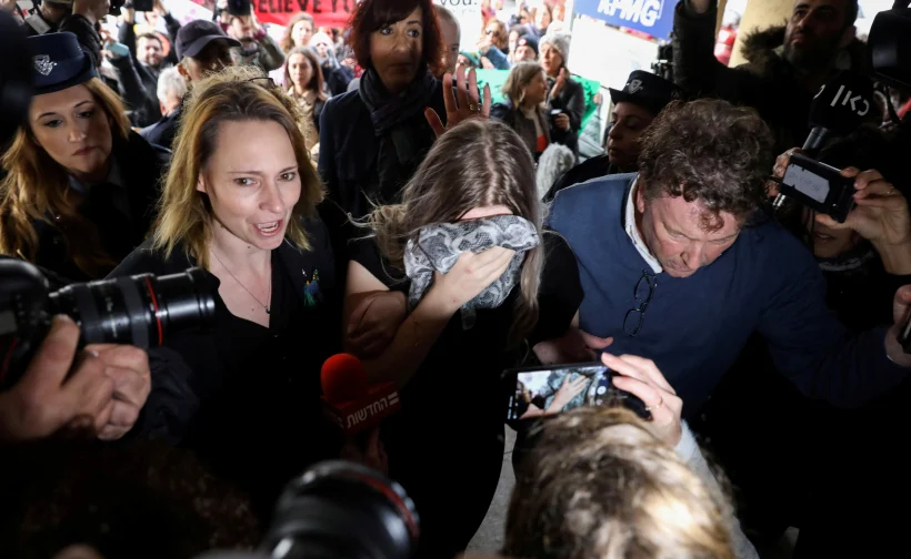 A British Woman, Accused Of Lying About Being Gang Raped, Covers Her Face As She Arrives At The Famagusta Courthouse In Paralimni