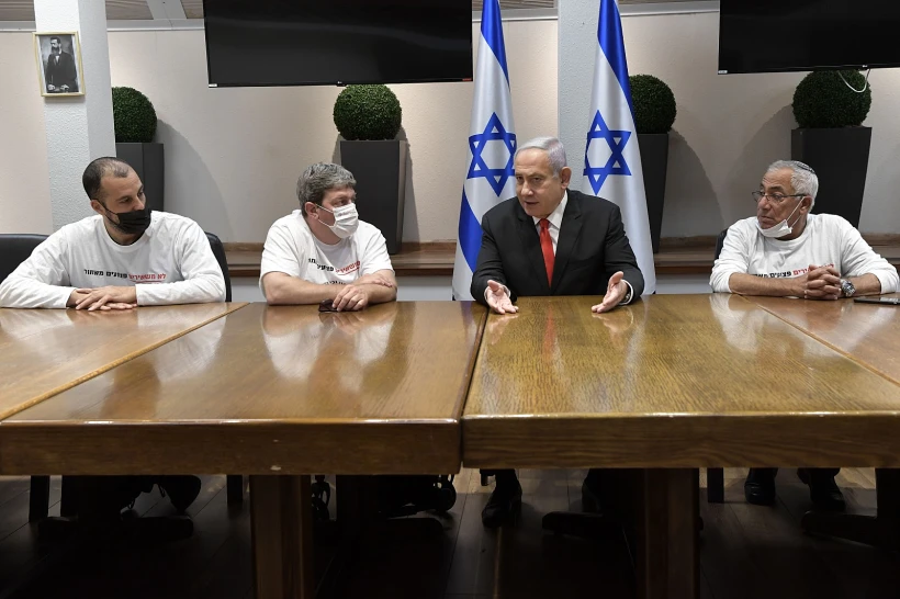 ראש הממשלה נתניהו עם יו״ר ארגון נכי צה״ל עידן קלימן .