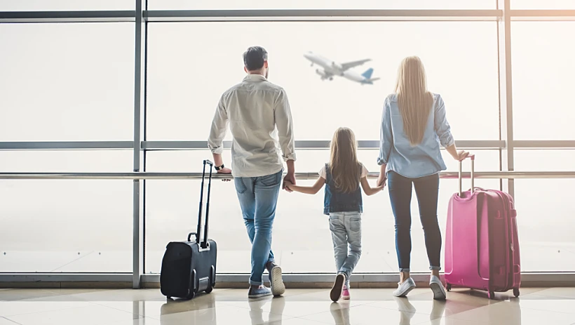 Family,in,airport.,attractive,young,woman,,handsome,man,and,their