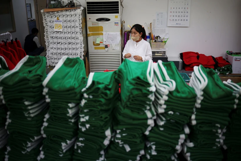 Green Tracksuits Inspired By Netflix Series ''squid Game'' Are Stacked At A Clothing Factory In Seoul