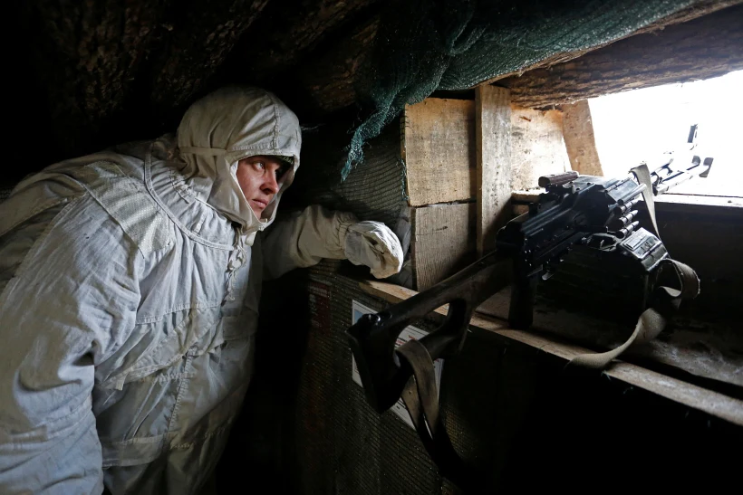A Militant Of The Self Proclaimed Donetsk People's Republic (dnr) Observes The Area At Fighting Positions In Donetsk Region