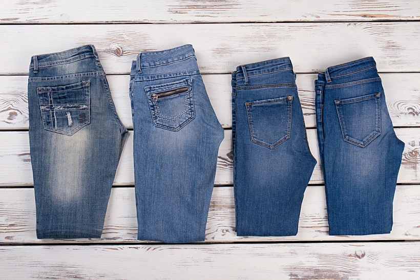 New,denim,collection,on,wooden,background.,refresh,your,wardrobe,with