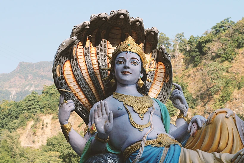 Four Armed,lord,vishnu,against,the,backdrop,of,mountains,in,rishikesh,
