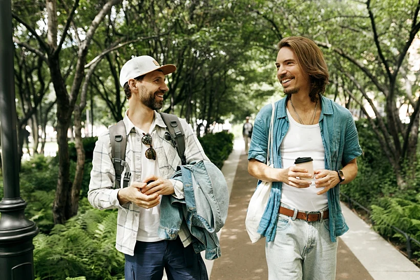 Adult,men,in,stylish,casual,clothes,strolling,in,city,under