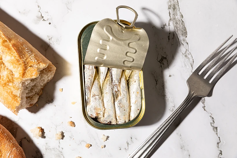 Canned,sardines,and,bread,isolated,on,kitchen,countertop