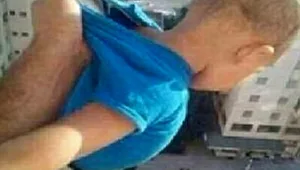 טלטל את בנו מחוץ לחלון כדי לקבל 1,000 לייקים בפייסבוק