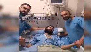 "רק עזרתי לבן אדם": תגובת עובד ביה''ח לתמונה עם מחבל חמאס