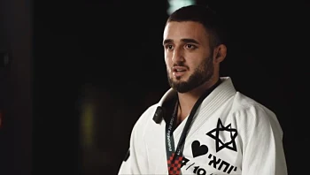 "נישאר כאן לנצח": אלוף הג'יו ג'יטסו שניצל מהטבח - וחולם על מדליה