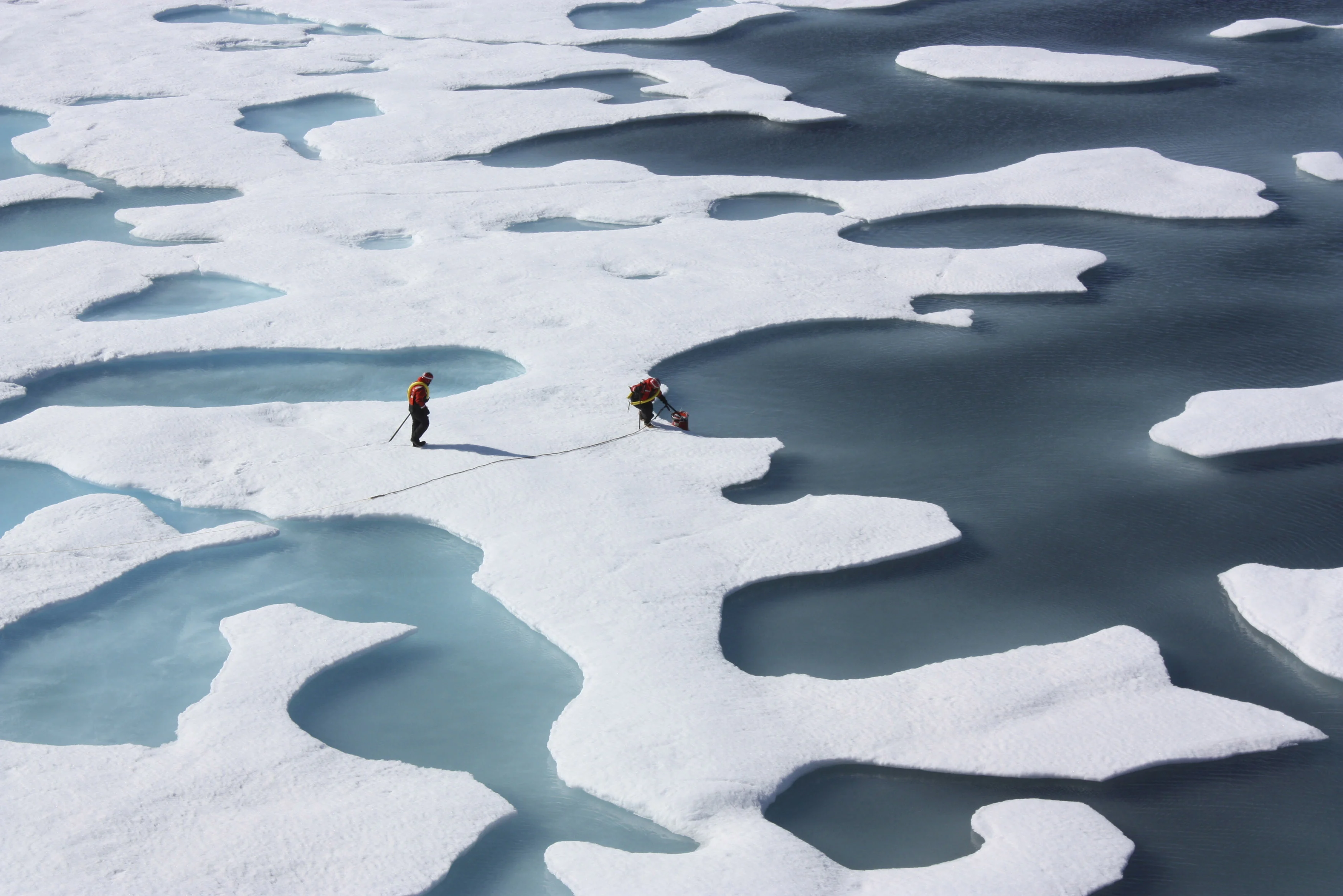 The Crew Of The U.s. Coast Guard Cutter Healy Retrieves Supplies Dropped By Parachute In The Arctic Ocean