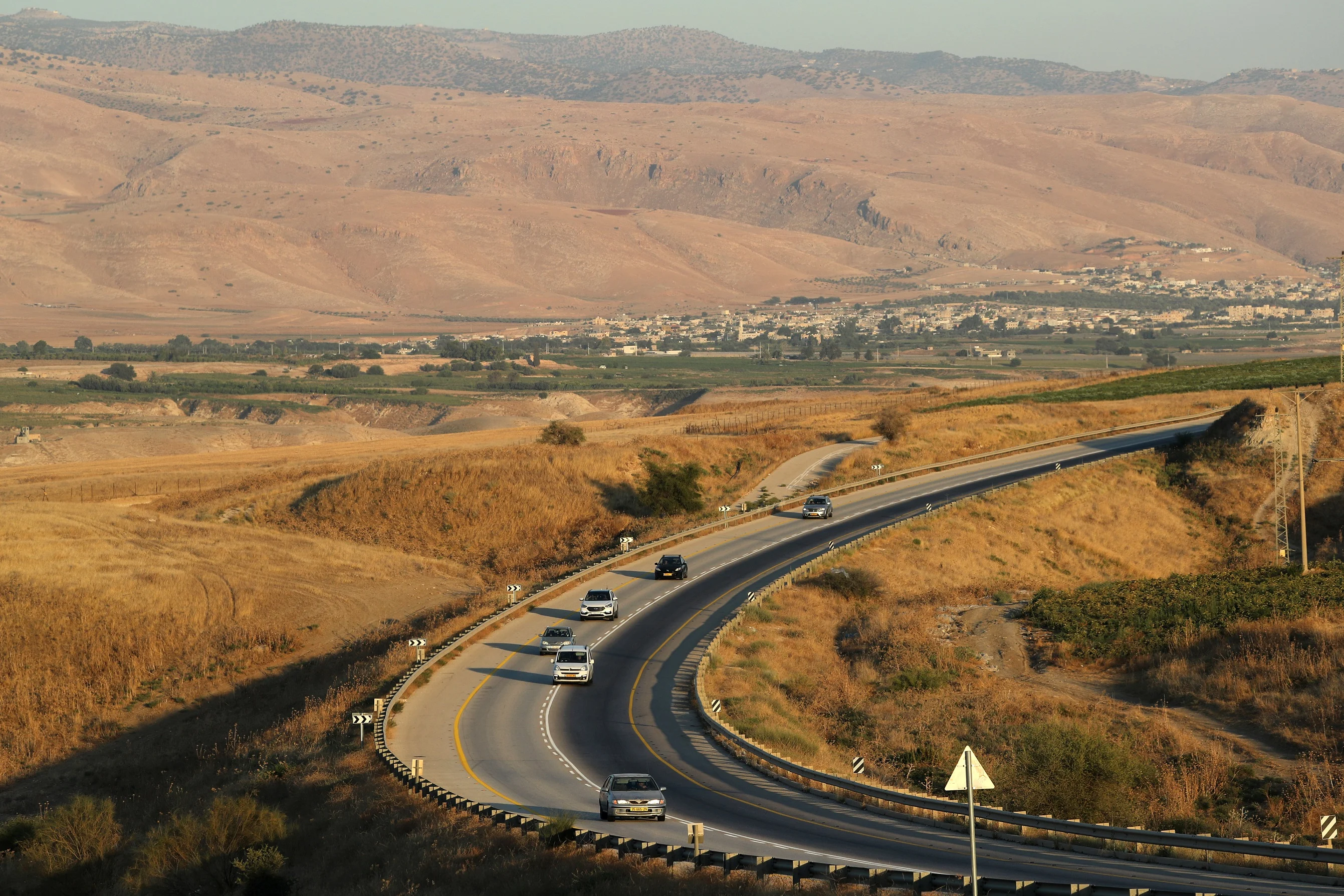 Vehicles Drive Through A Road In Jordan Valley, The Eastern Most Part Of The Israeli Occupied West Bank That Borders Jordan