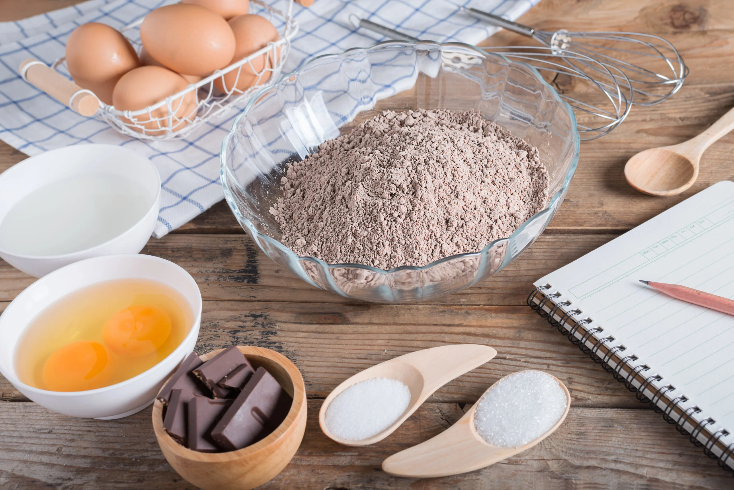 Ingredients,for,making,cake,chocolate,with,notebook,for,recording,menu