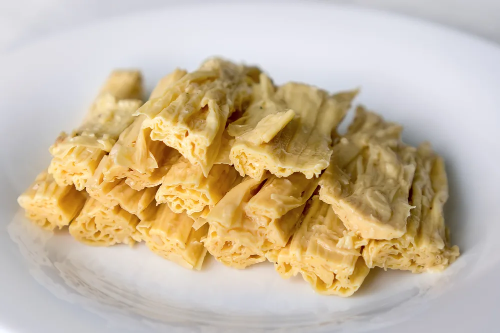 Tofu,skin,(yuba,sticks,or,fuzhu),on,plate.,healthy,asian