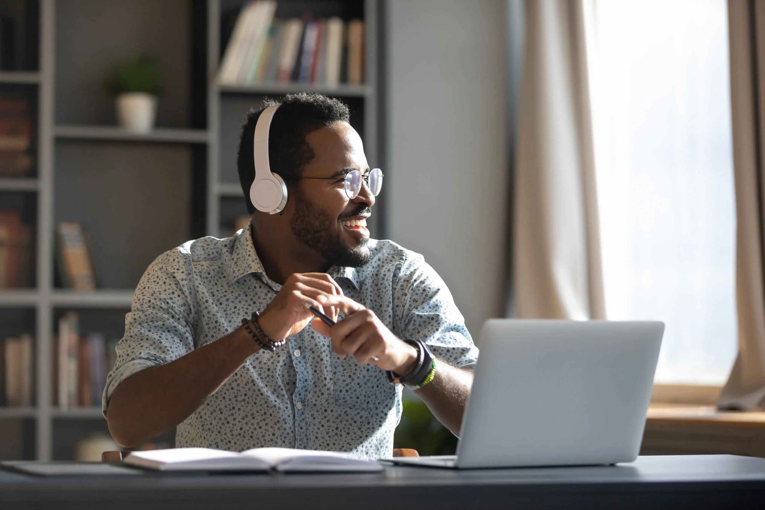 Happy,relaxed,millennial,afro,american,business,man,wear,wireless,headphones