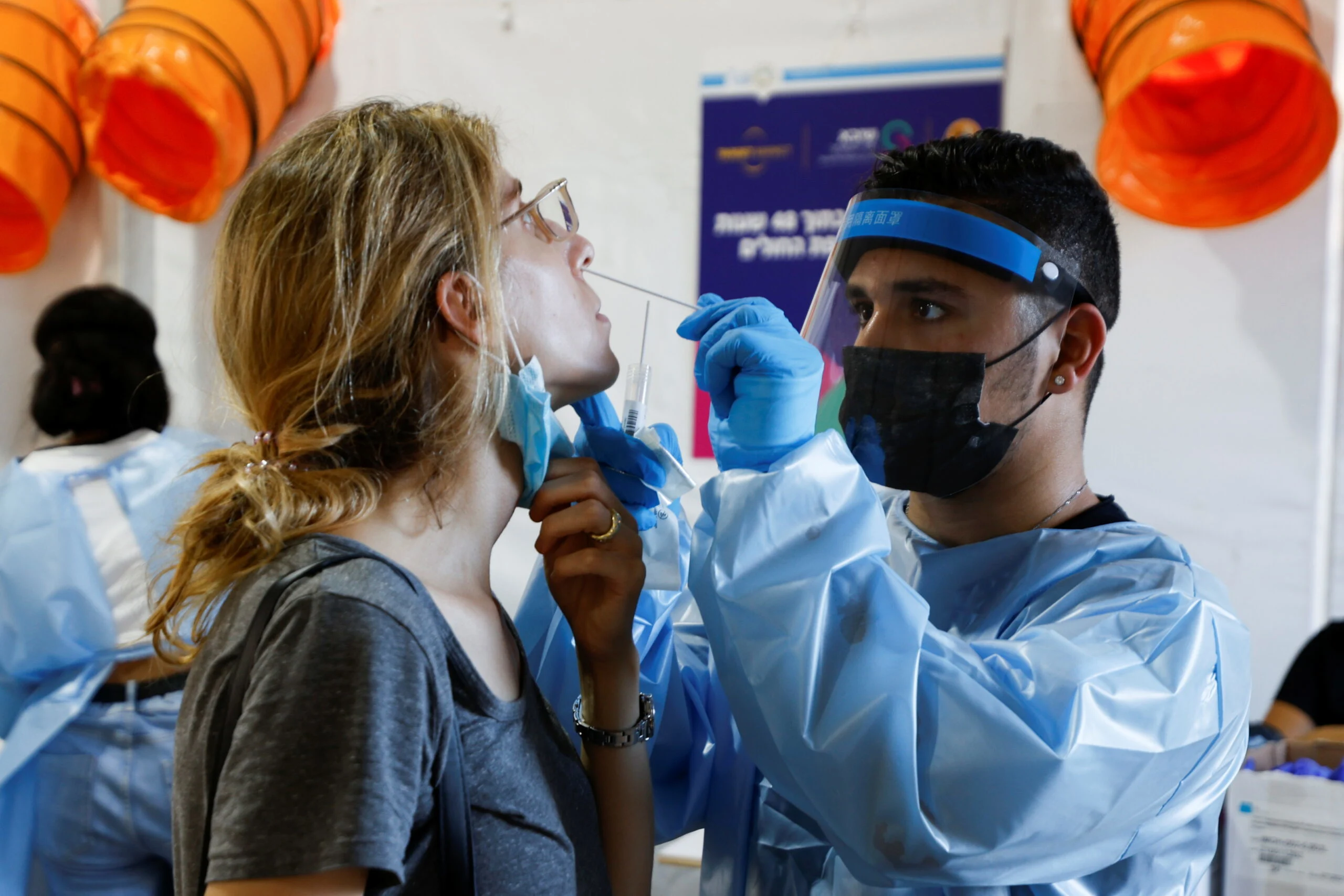 People Wait To Be Tested At A Temporary Coronavirus Disease (covid 19) Testing Centre In Tel Aviv