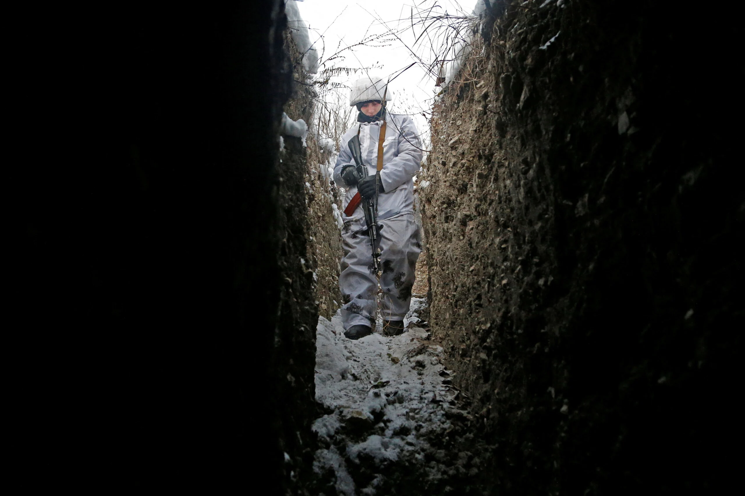 A Militant Of The Self Proclaimed Luhansk People's Republic Walks In A Trench At A Fighting Position In Luhansk Region