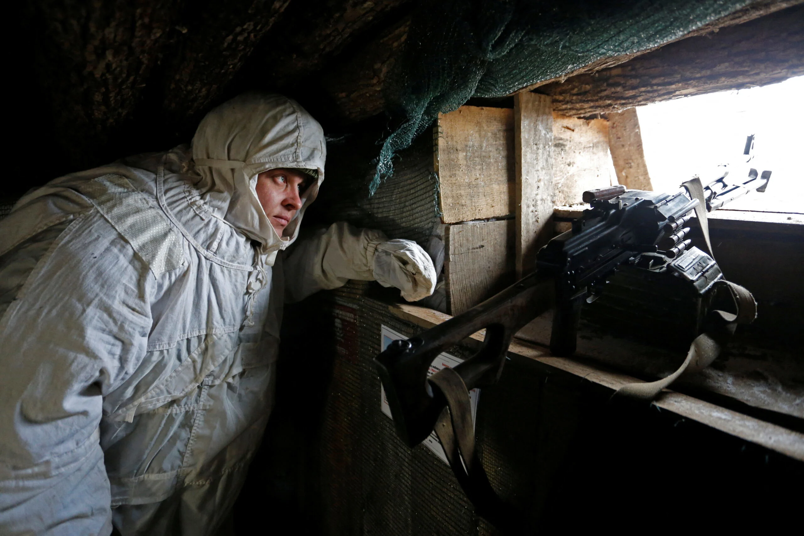 A Militant Of The Self Proclaimed Donetsk People's Republic (dnr) Observes The Area At Fighting Positions In Donetsk Region