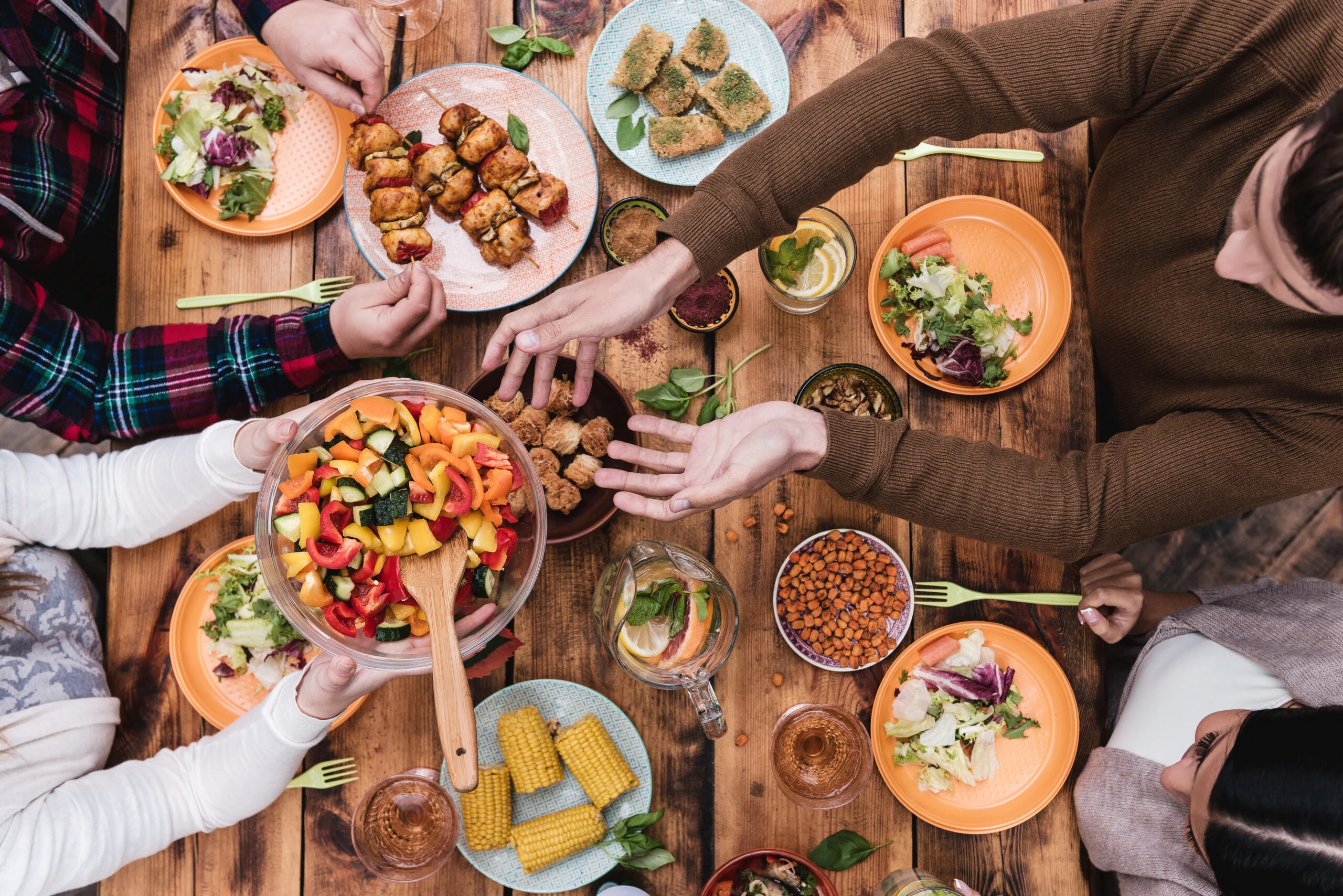 Friends,having,dinner.,top,view,of,four,people,having,dinner