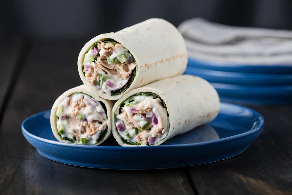Tuna,burritos,with,cucumber,red,onion,and,mayonnaise,on,rustic