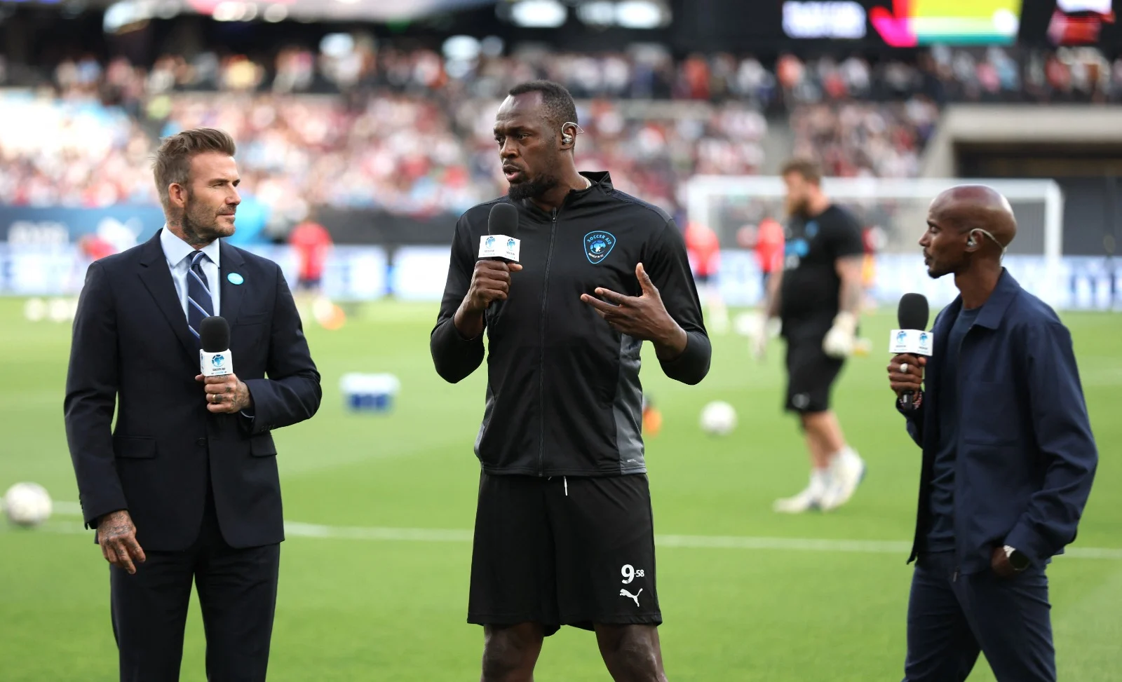 מו פארח (ימין) עם האלוף האולימפי יוסיין בולט והכדורגלן דיוויד בקהאם